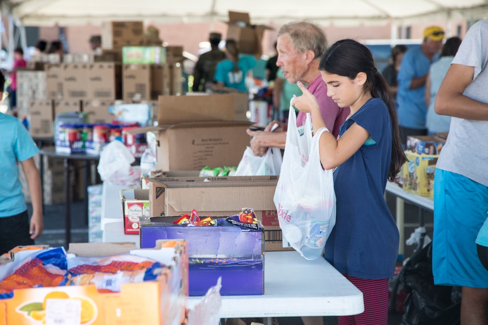 Volunteers mobilized to help with relief efforts at a point of distribution site in Panama City Beach