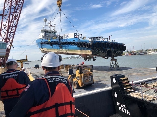 Coast Guard oversees damaged vessel lift operation near Cameron, Louisiana