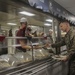 Food Service Marines aboard the USS Wasp serve food