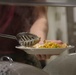 Food Service Marines aboard the USS Wasp serve food