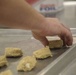 Food Service Marines aboard the USS Wasp serve food