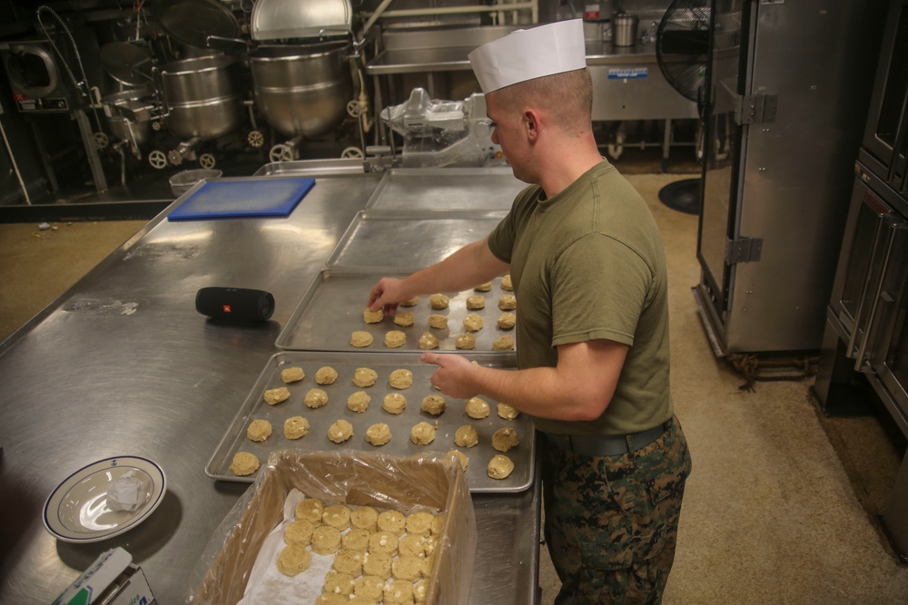 Food Service Marines aboard the USS Wasp serve food