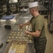 Food Service Marines aboard the USS Wasp serve food