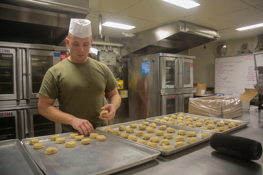 Food Service Marines aboard the USS Wasp serve food