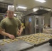 Food Service Marines aboard the USS Wasp serve food