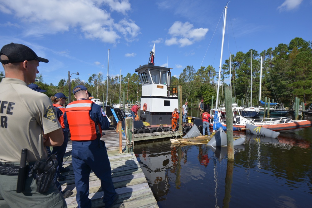 Federal and State agencies observe Resolve Marine Group during boat lift operations in Minnesott Beach, NC