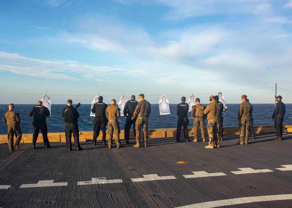 Marines Coach Sailors on pistol marksmanship and machine gunnery