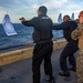 Marines Coach Sailors on pistol marksmanship and machine gunnery