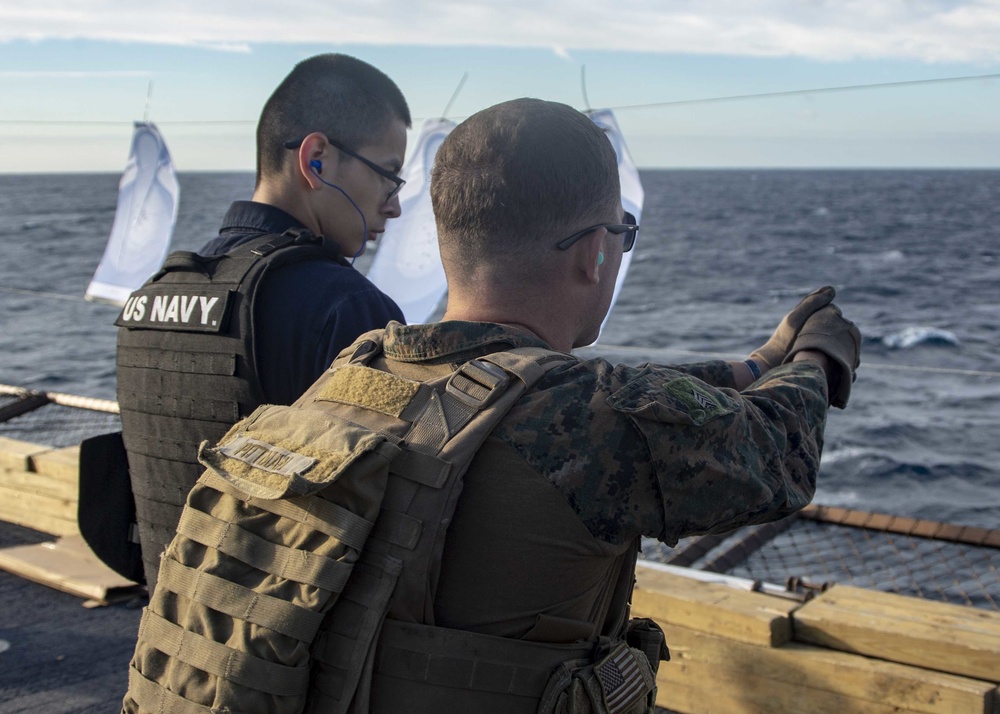 Marines Coach Sailors on pistol marksmanship and machine gunnery