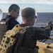 Marines Coach Sailors on pistol marksmanship and machine gunnery