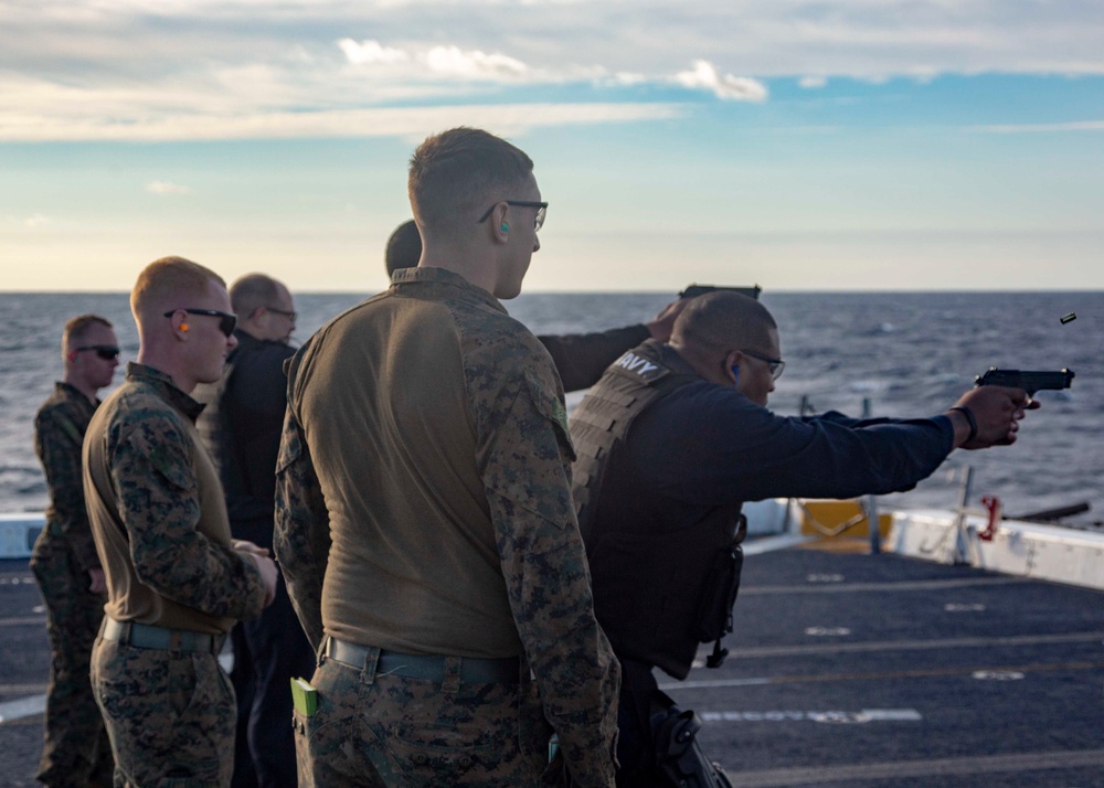 Marines Coach Sailors on pistol marksmanship and machine gunnery