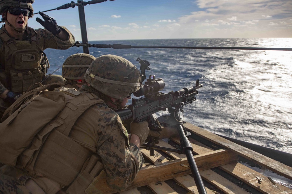 Marines Coach Sailors on pistol marksmanship and machine gunnery