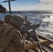 Marines Coach Sailors on pistol marksmanship and machine gunnery