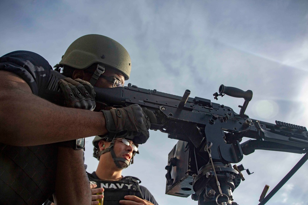 Marines Coach Sailors on pistol marksmanship and machine gunnery