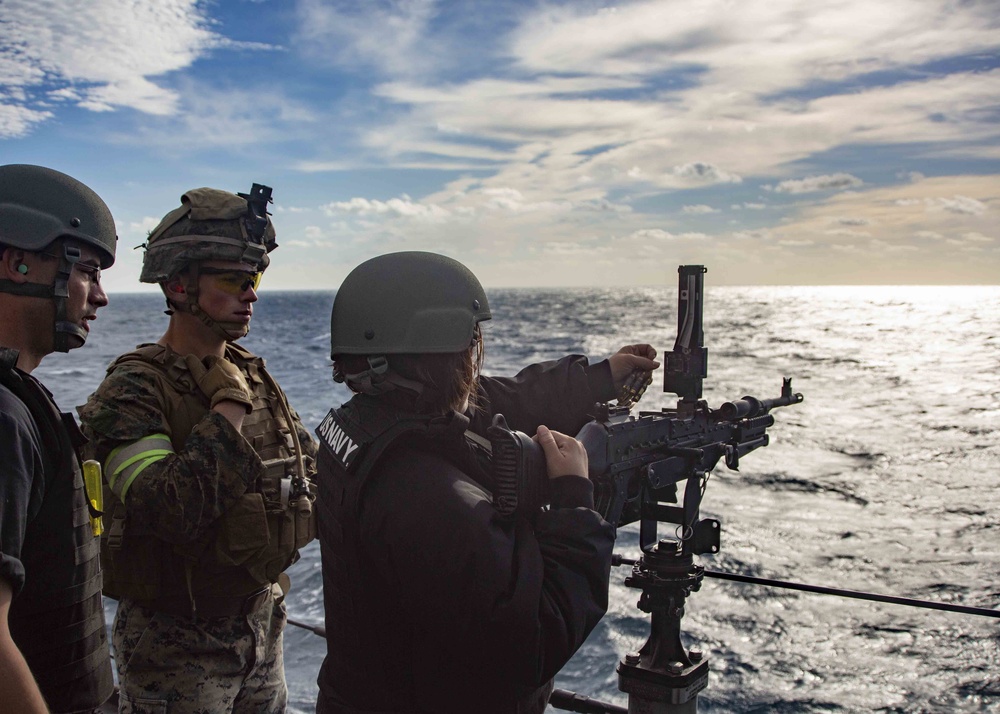 Marines Coach Sailors on pistol marksmanship and machine gunnery