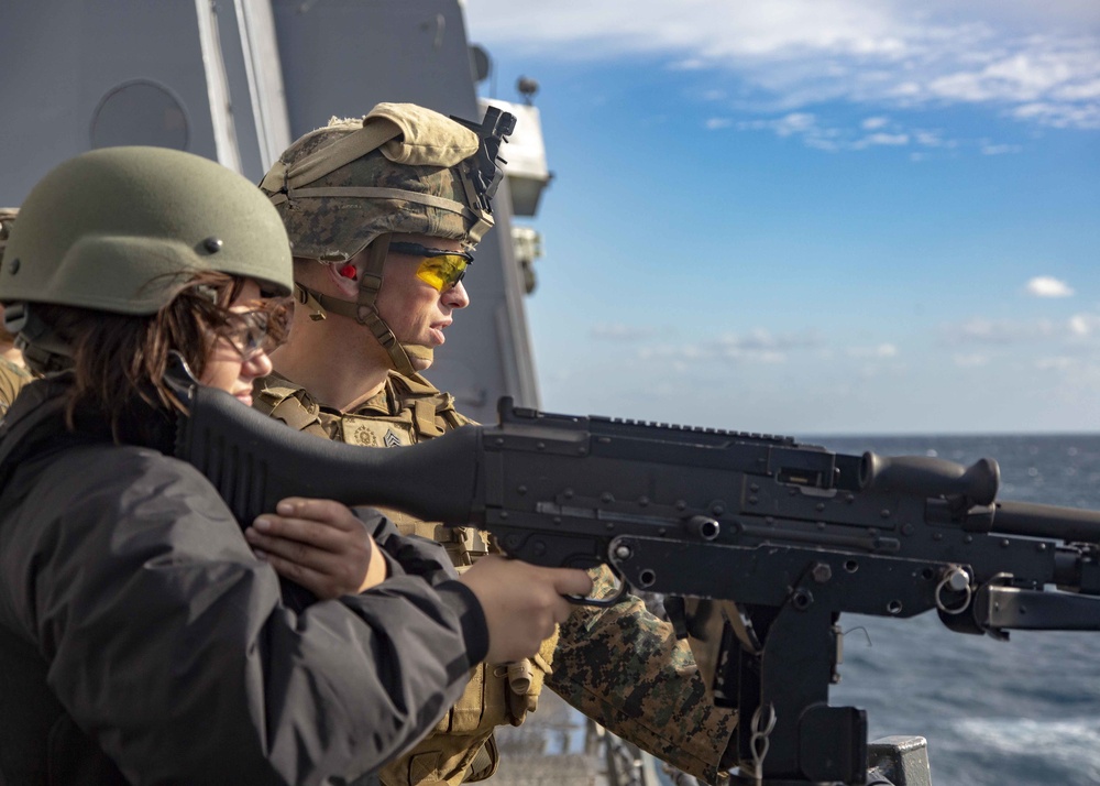 Marines Coach Sailors on pistol marksmanship and machine gunnery