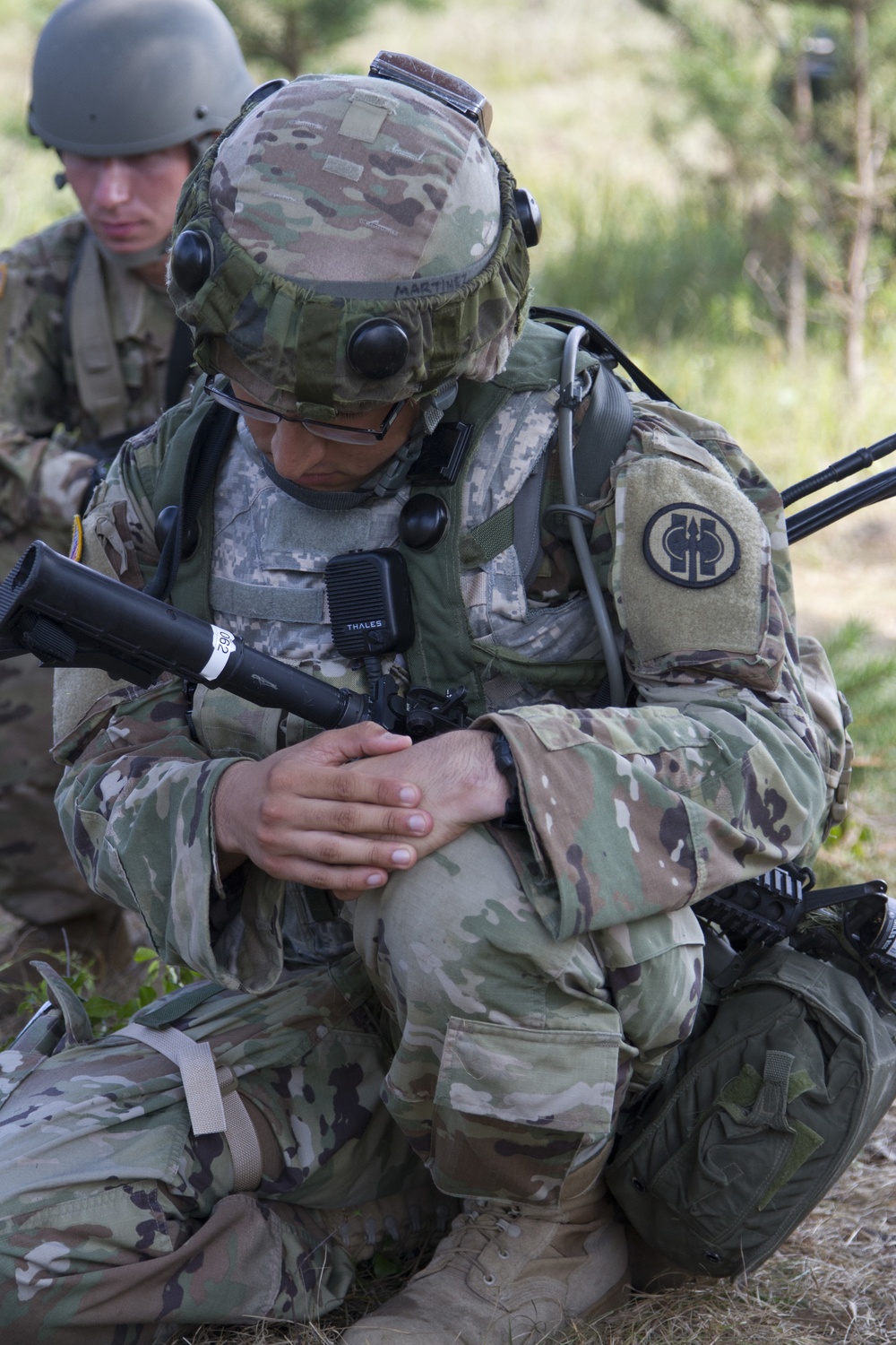2Lt. Alberto Martinez, 491st Military Police Company, Riverside, California, prays during a religious service at Fort McCoy
