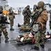 Mass casualty drill in a CBRN environment aboard USS Wasp
