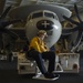 Aviation Boatswain’s Mate (Handling) 2nd Class Justin Hill, from Bakersfield, California, maneuvers an E-2C Hawkeye, with Electronic Attack Squadron (VAQ) 133, in the hangar bay aboard the Nimitz-class aircraft carrier USS John C. Stennis (CVN 74).