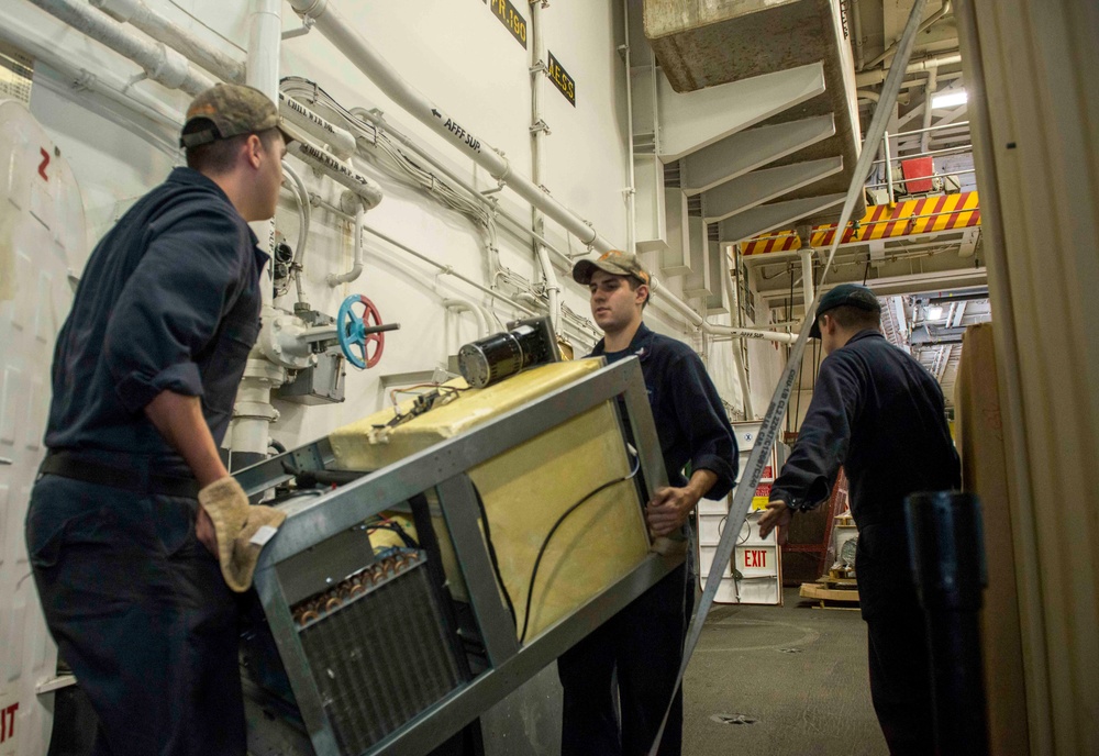 Sailors Carry Ice Maker