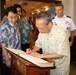 Japan Ministry of Defense leader signs guest book ahead of office call with Pacific Ocean Division leaders