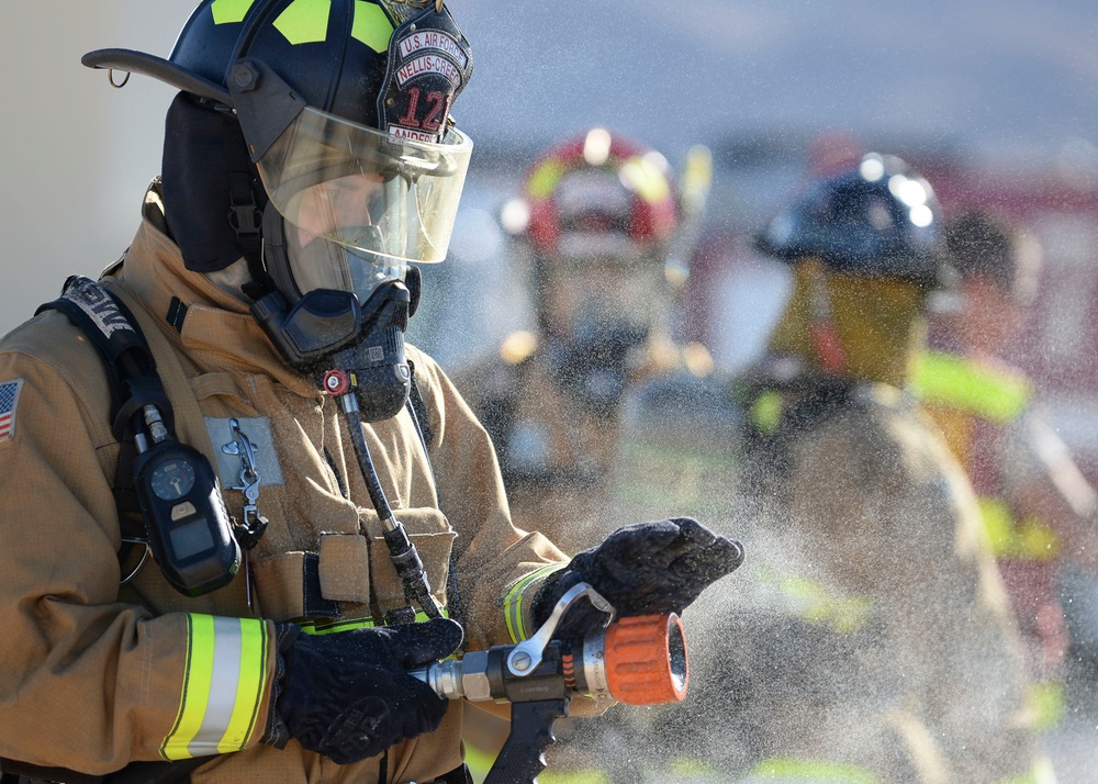 99th CES, local fire department battle simulated aircraft fire