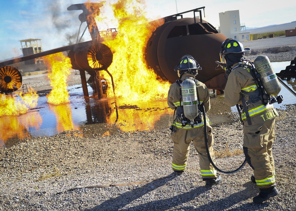 99th CES, local fire department battle simulated aircraft fire