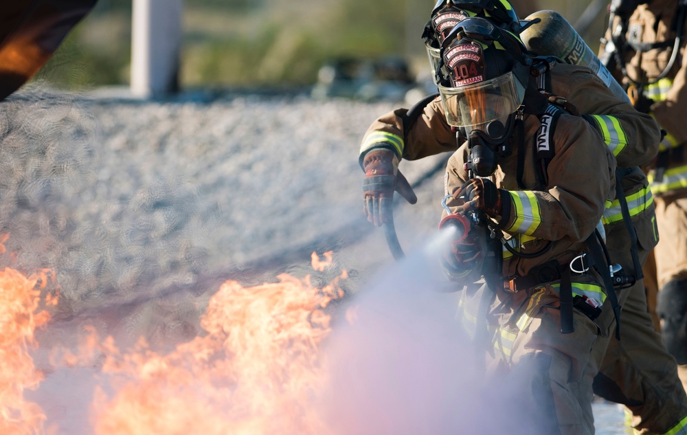 99th CES, local fire department battle simulated aircraft fire