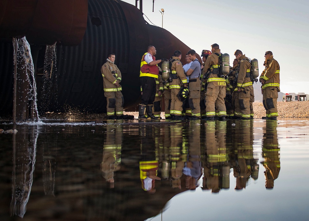 99th CES, local fire department battle simulated aircraft fire