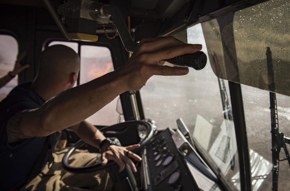 99th CES, local fire department battle simulated aircraft fire