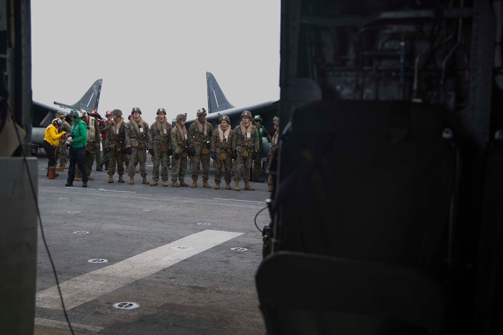 Marines fast-rope onto the USS Kearsarge