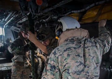 Marines fast-rope onto the USS Kearsarge