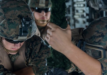 Marines fast-rope onto the USS Kearsarge