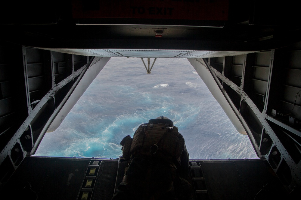 Marines fast-rope onto the USS Kearsarge