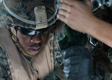 Marines fast-rope onto the USS Kearsarge