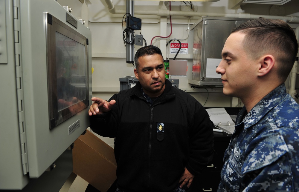 EMC John Chavez-Sanchez Trains a Ford Sailor