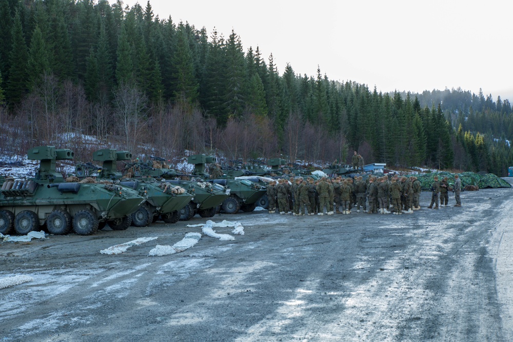 Marines with 2nd Light Armored Reconnaissance prepare snow camouflage