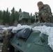 Marines with 2nd Light Armored Reconnaissance prepare snow camouflage