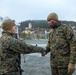 Marines with 2nd Light Armored Reconnaissance prepare snow camouflage