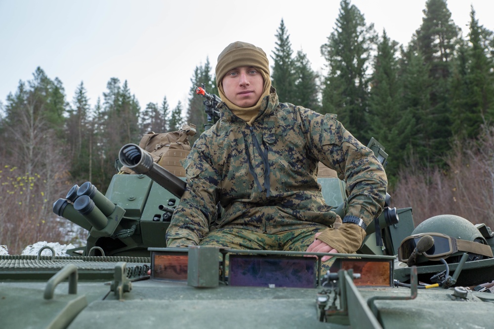 Marines with 2nd Light Armored Reconnaissance prepare snow camouflage