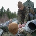 Marines with 2nd Light Armored Reconnaissance prepare snow camouflage