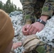 Marines with 2nd Light Armored Reconnaissance prepare snow camouflage