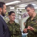 Tyler Wordsworth From the Canadian Embassy talks with Canadian Forces Aboard USNS Comfort