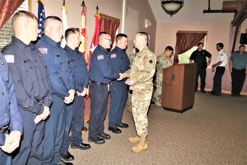 Fort McCoy members presented with 2-star commander's coin during ceremony