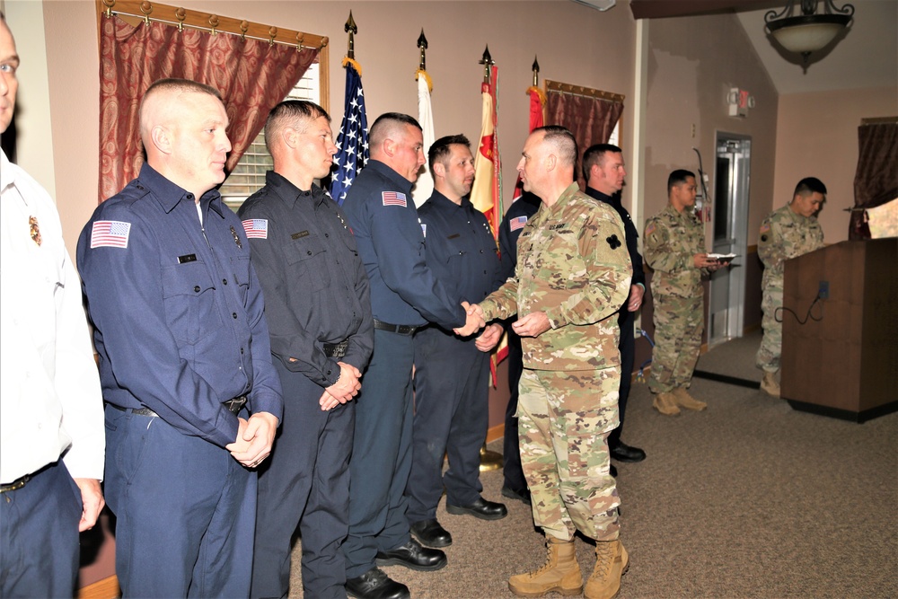 Fort McCoy members presented with 2-star commander's coin during ceremony