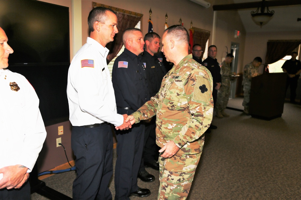 Fort McCoy members presented with 2-star commander's coin during ceremony