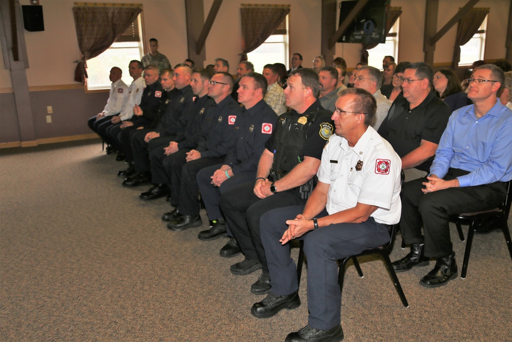 Fort McCoy members presented with 2-star commander's coin during ceremony