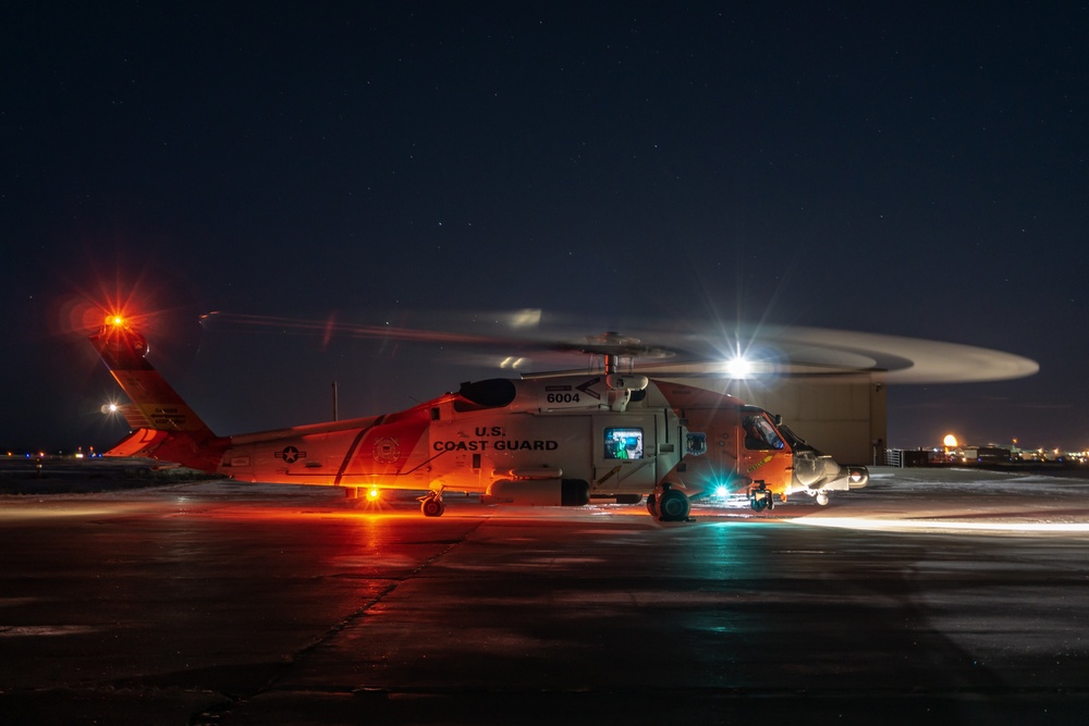 Coast Guard Air Station Kodiak aircrew members prepare for night flight, Kotzebue, Alaska