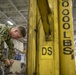 Sailors repair ship's christening seal