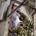 Sailors repair ship's christening seal